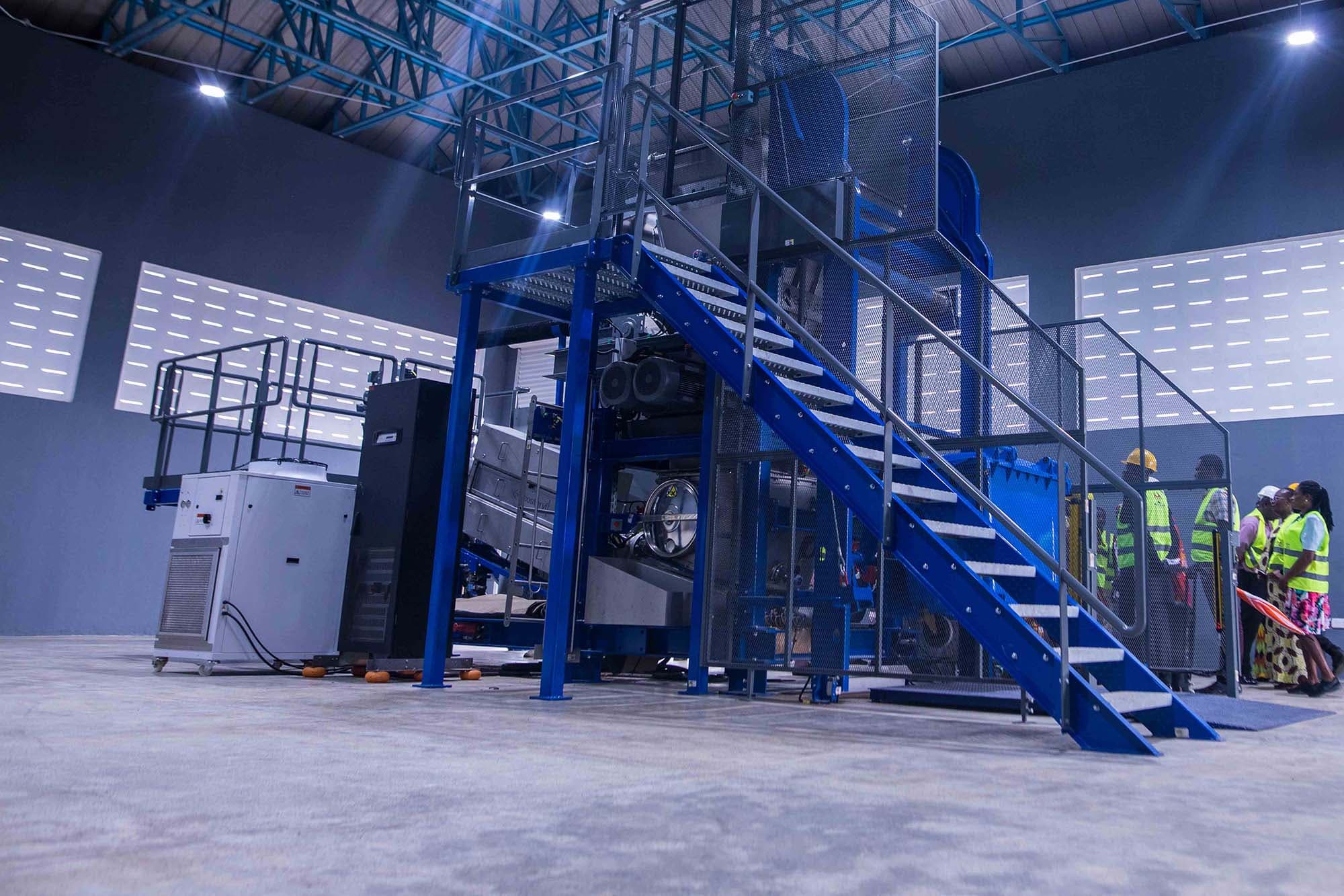 Team members observing a Jospong waste-processing facility